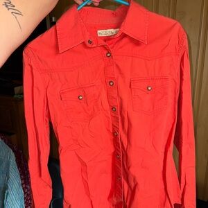 Woman’s Rockies Vibrant Orange Rodeo Shirt